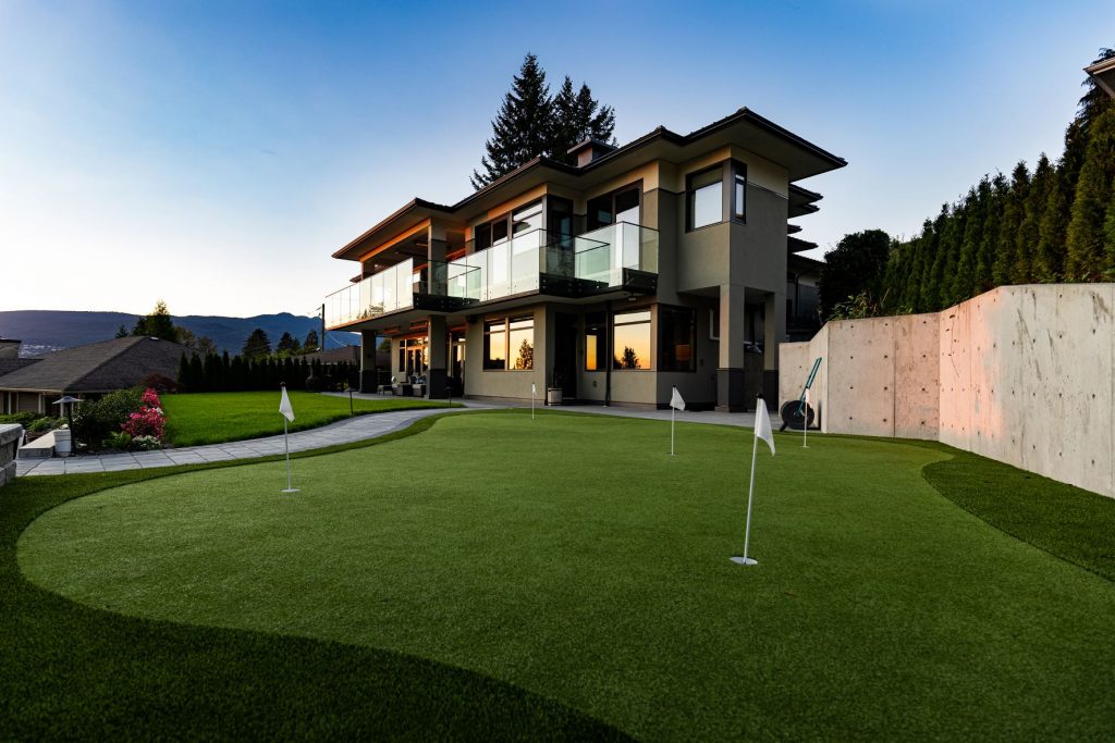 New home construction in North Vancouver with custom putting green in back yard